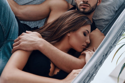 couple laying in bed and cuddling, loving, cute, sweet