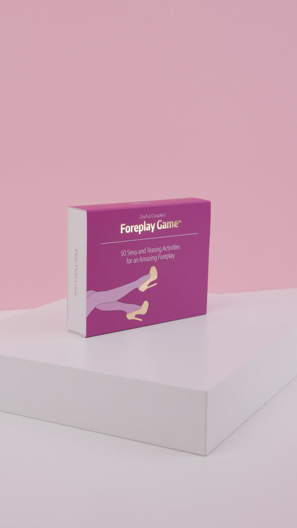 joyful couple's foreplay game stylish unboxing on purple background